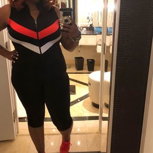 One piece suit. Fashionable onesie. With zipper.